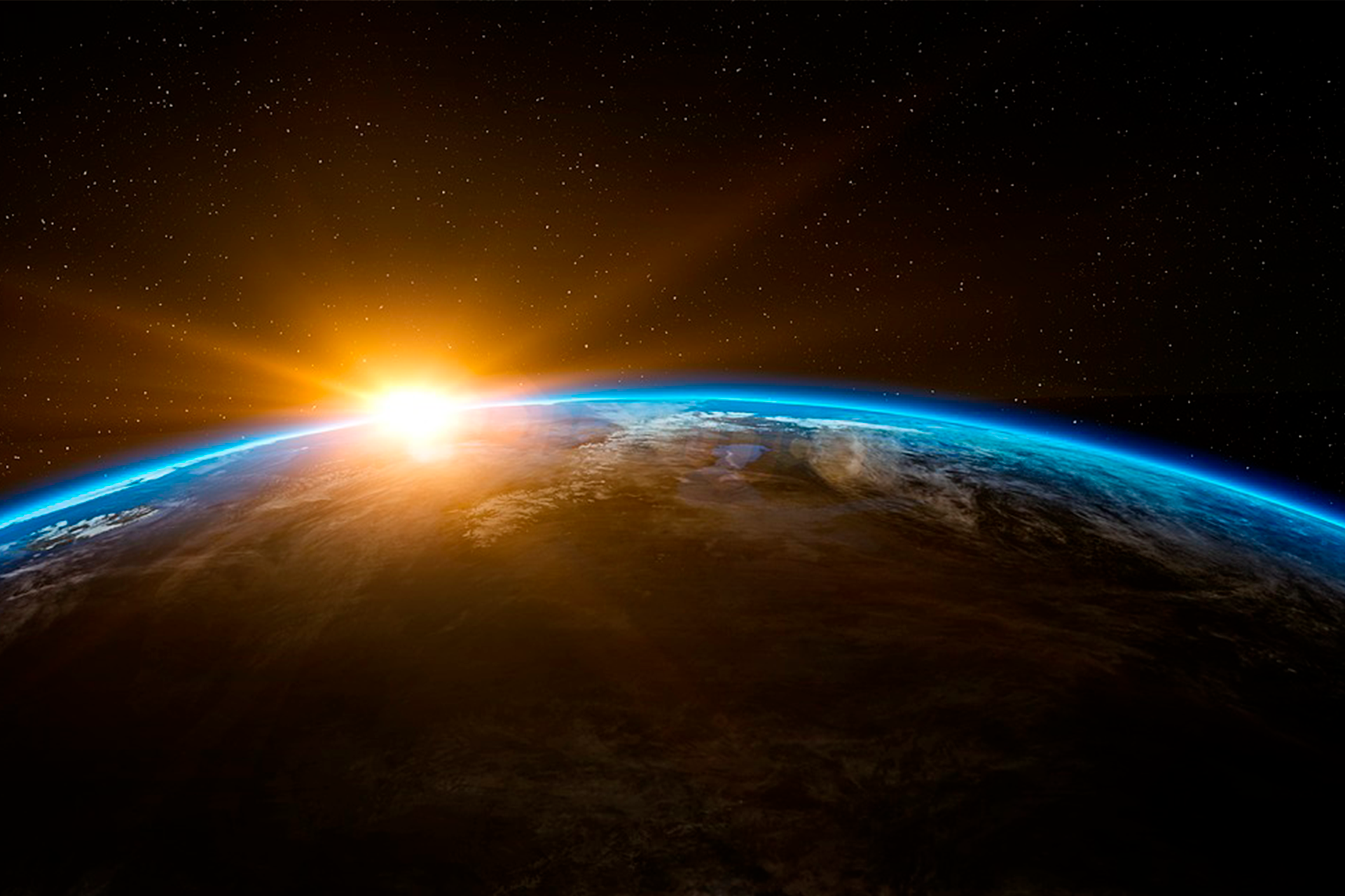 arco azul do contorno da parte superior da Terra em meio ao escuro do universo e o Sol por detrás 